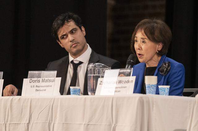 Enayat Nazhat reacts as U.S. Rep. Doris Matsui, right, speaks during a congressional candidate forum for CA District 7 at Coloma Center in Sacramento on Thursday, April 2, 2026.