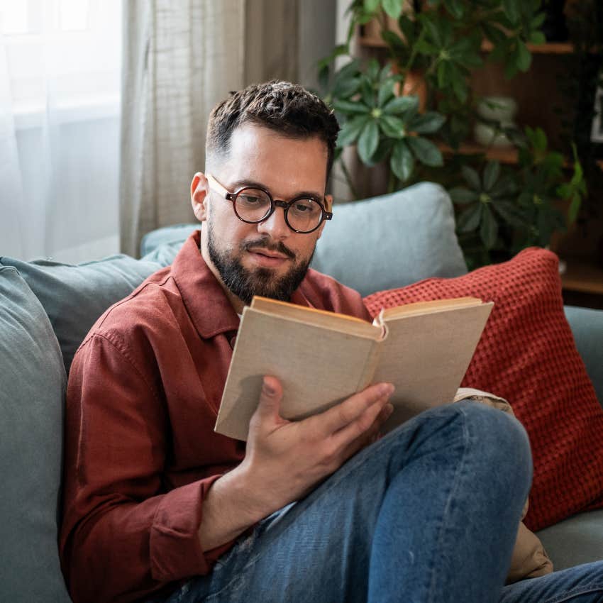 intelligent man reading a book in solitude