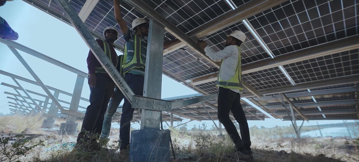 A technician works on solar panels in Chhattisgarh, India.